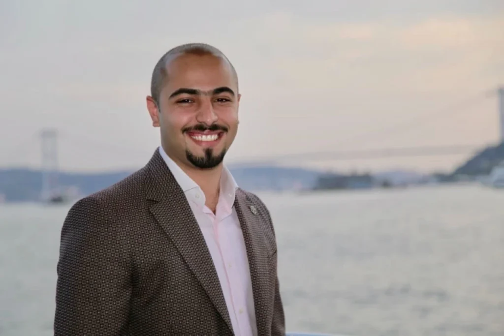 Global Entrepreneurship Month: Qnet Success Stories To Inspire 8 Mustafa Negm in an ocean background