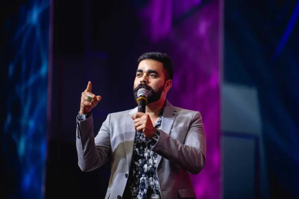 Global Entrepreneurship Month: Qnet Success Stories To Inspire 5 Nasib BR on stage talking