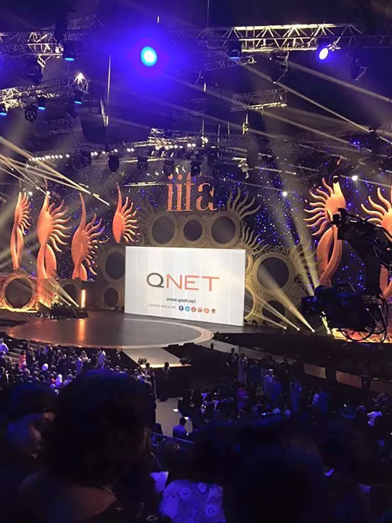 QNET backdrop at the IIFA awards 2015