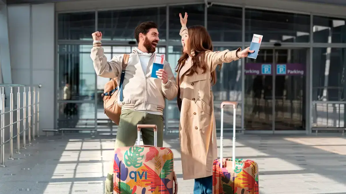 Couple excited to escape winter season by going on a budget-friendly package holiday, which they booked through QVI Vacay