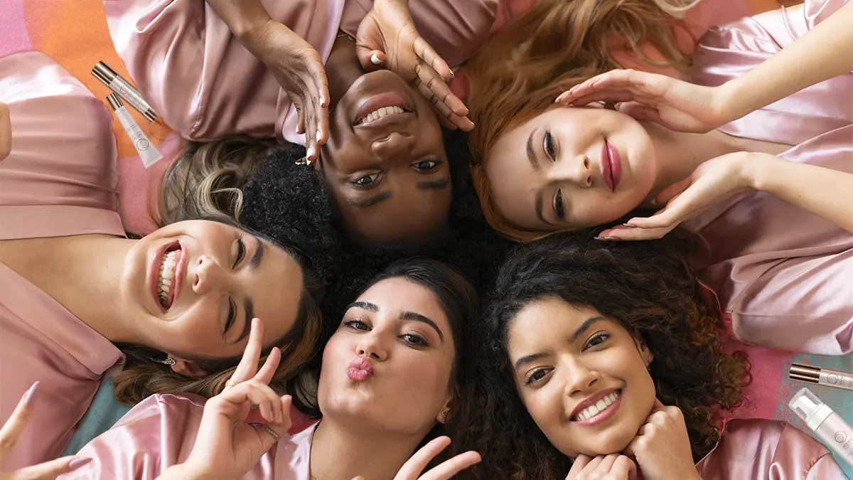 Gift Guide For Her: Special Gifts Every Woman Will Love 4 Women lying down surrounded by Physio Radiance products, some of the popular QNET gifts for women.