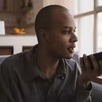 Man recording a voice message and wondering is the middle class the new poor