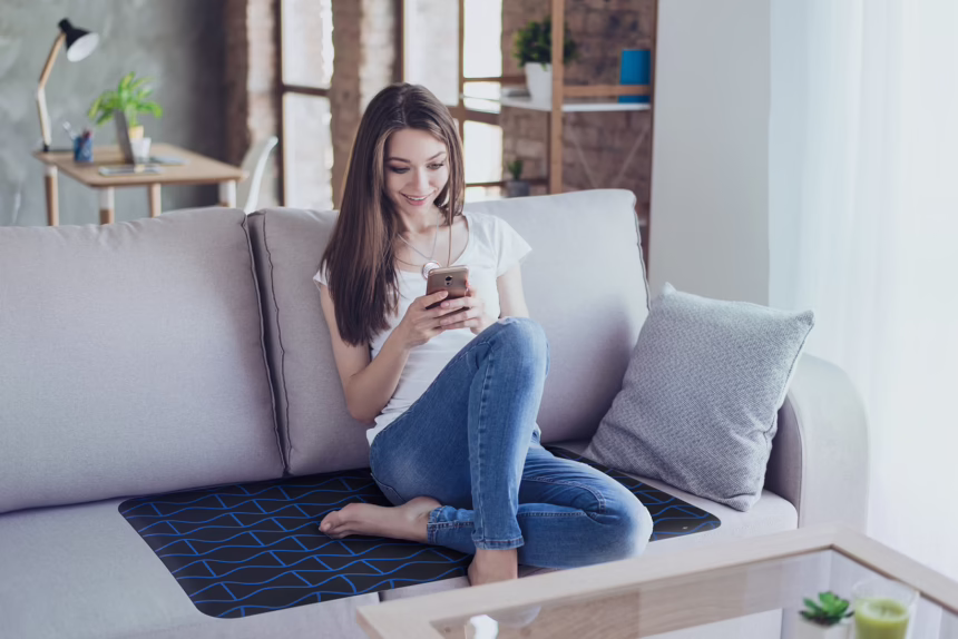 Girl using Amezcua GX-1 on the couch